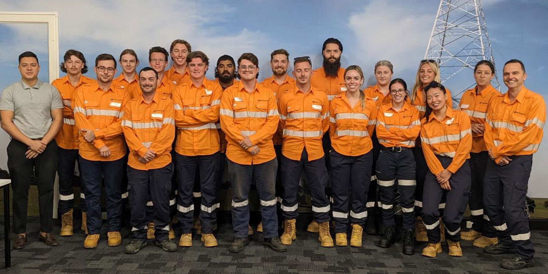 Western Power's 19 new apprentices stood together in a function room